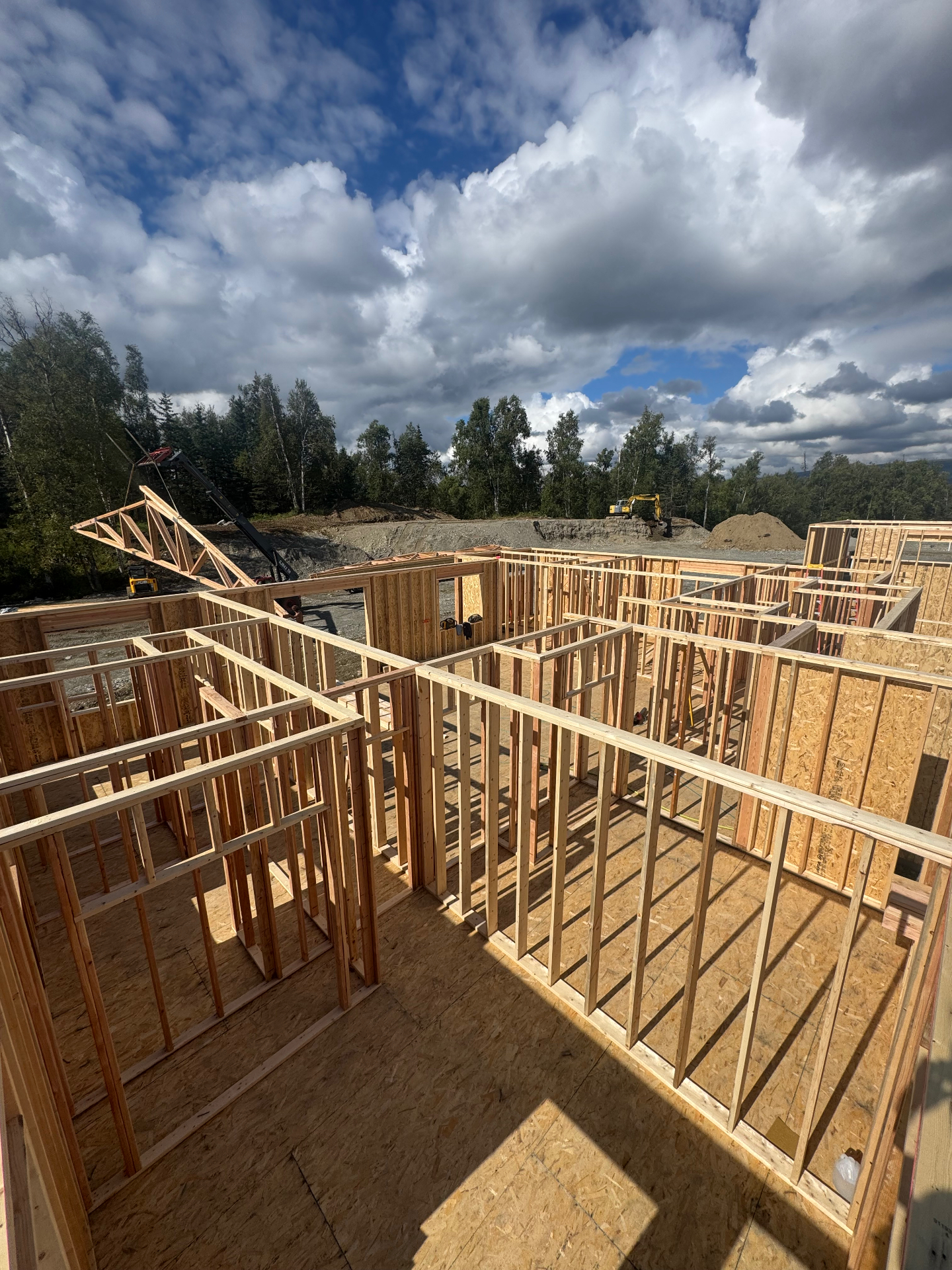 Interior wood wall framing and floor sheathing at a new construction site